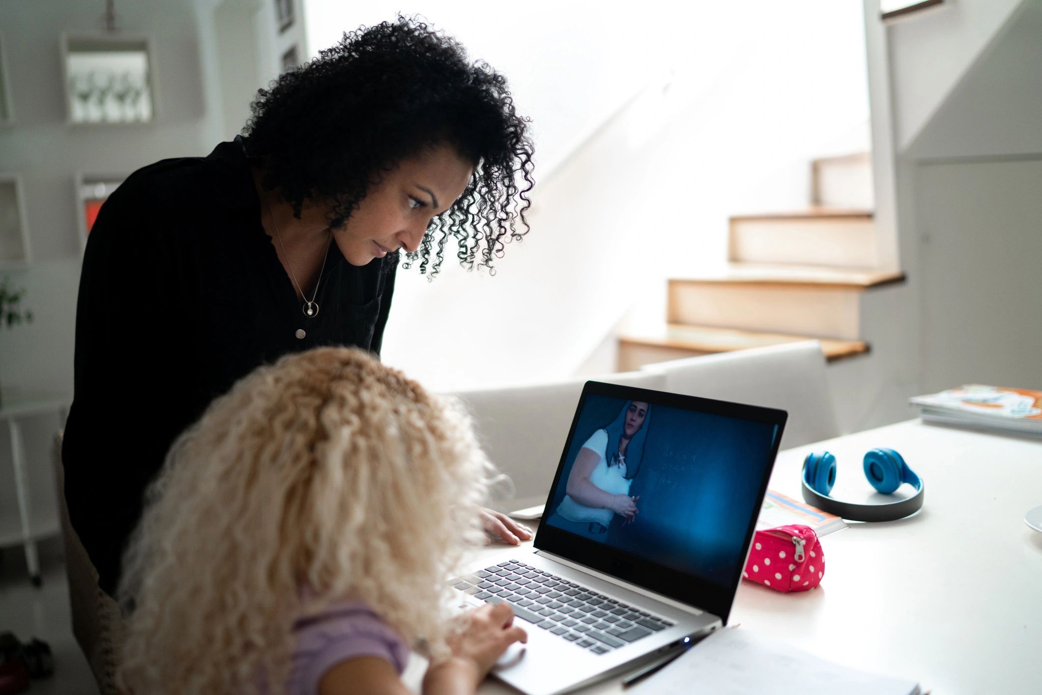 Instructor helping a learner during an online study session