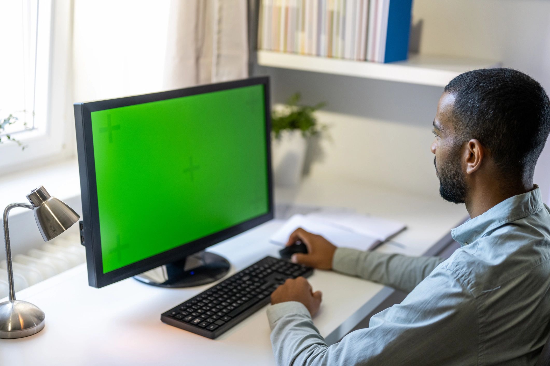 Student studying on a computer at home